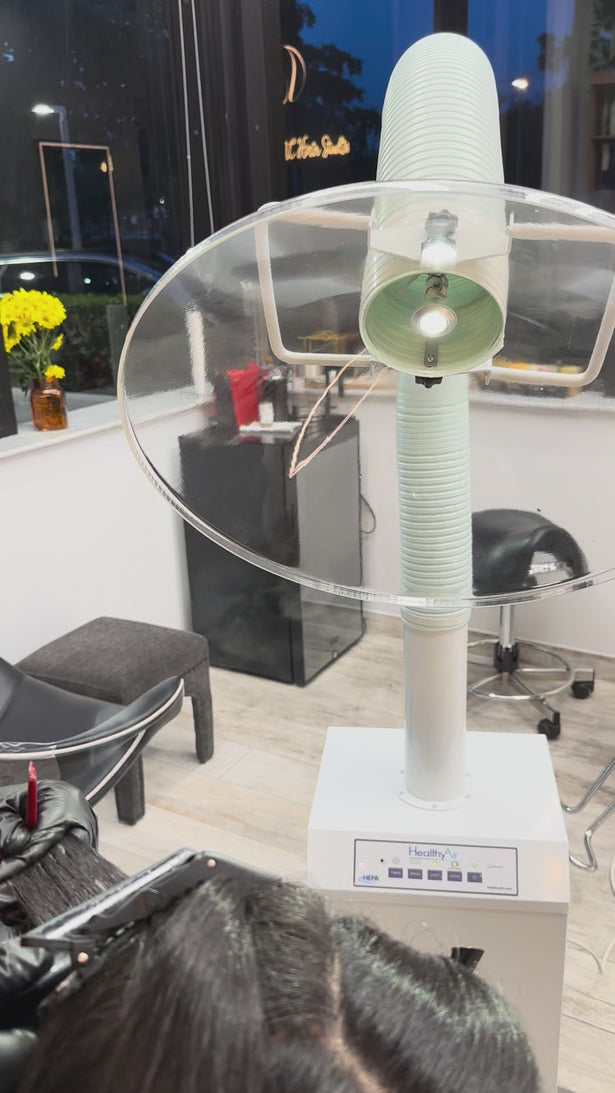 The HealthyAir Chemical Source Capture System eliminates harmful fumes at the source during coloring, highlighting, and keratin treatments. This mobile filtration unit features an overhead extractor arm that captures dangerous chemicals like formaldehyde and hydrogen sulfide before they spread throughout your salon.